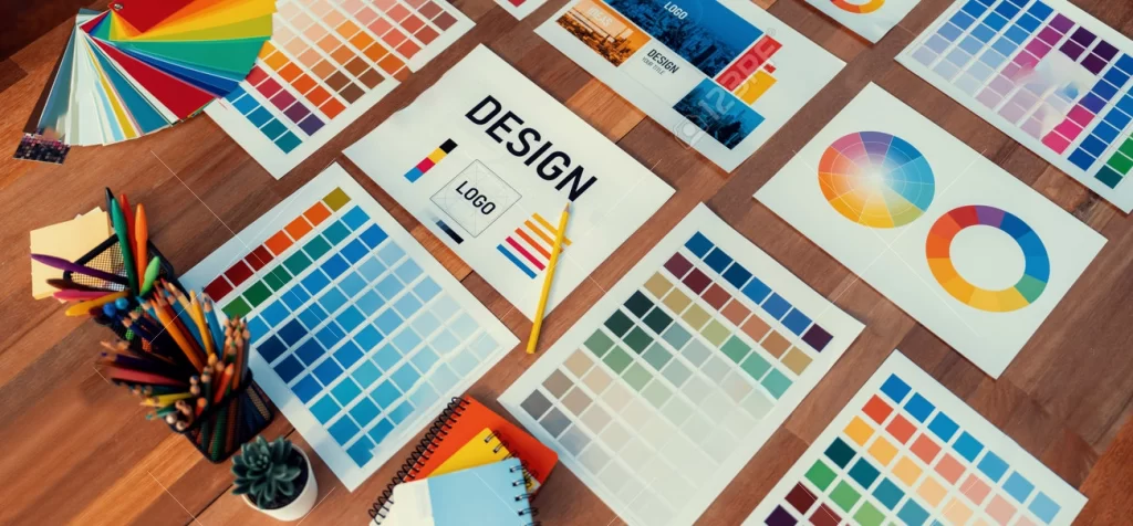 206707378-panorama-shot-of-various-color-palette-idea-papers-arranged-neatly-on-workspace-table-for-graphic